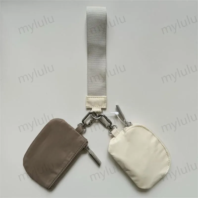New Womens Dual Key Pouch Blutch Bag Diseñador de billetera Billetera Tiestra de carteras de monedas de monedas de lona lienzo d