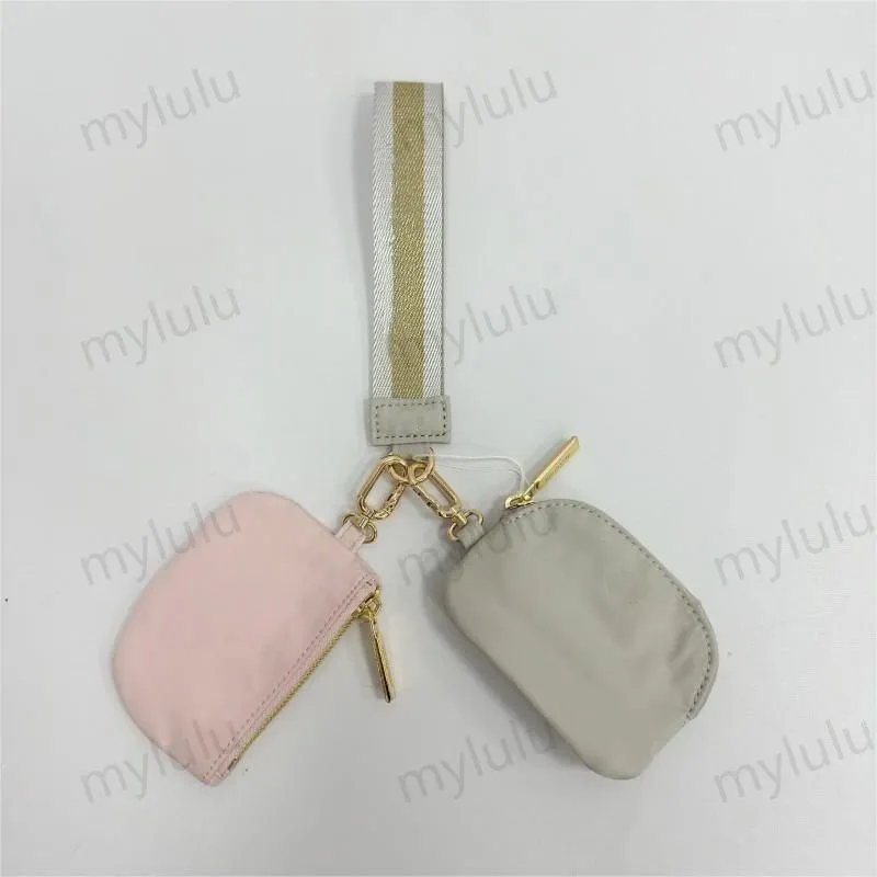 New Womens Dual Key Pouch Blutch Bag Diseñador de billetera Billetera Tiestra de carteras de monedas de monedas de lona lienzo d